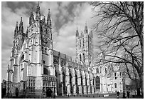 Canterbury Cathedral with people strolling on precincts. Canterbury,  Kent, England, United Kingdom ( black and white)