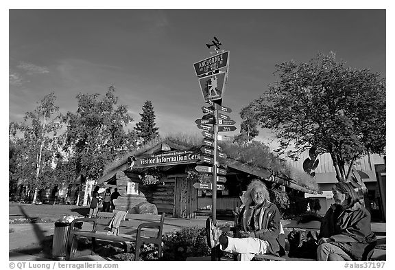 Native people sitting in front of visitor center. Anchorage, Alaska, USA