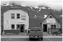 Cabins on the waterfront and red truck. Whittier, Alaska, USA (black and white)