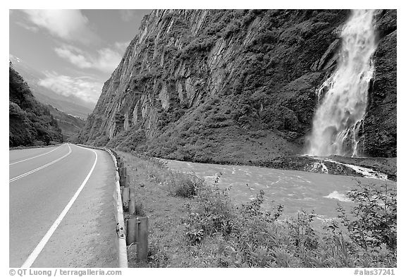 Bridalveil Falls cascading next to rood, Keystone Canyon. Alaska, USA