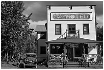 Small hotel with classic car parked by, afternoon. McCarthy, Alaska, USA (black and white)