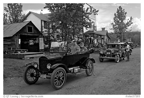 Classic cars driven on main street. McCarthy, Alaska, USA (black and white)