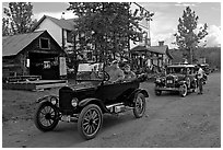 Classic cars driven on main street. McCarthy, Alaska, USA (black and white)