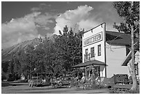 Hotel, main street, vintage car, and truck. McCarthy, Alaska, USA (black and white)