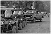 Four wheelers parked on main street. McCarthy, Alaska, USA ( black and white)