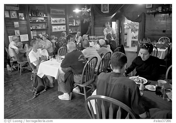 Dinner inside Mc Carthy lodge. McCarthy, Alaska, USA (black and white)