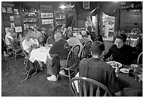 Dinner inside Mc Carthy lodge. McCarthy, Alaska, USA ( black and white)