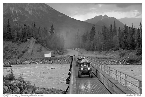 Four wheeler crossing the footbridge. McCarthy, Alaska, USA (black and white)