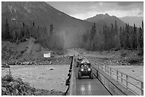 Four wheeler crossing the footbridge. McCarthy, Alaska, USA ( black and white)