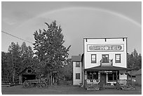 Rainbow over the historic Ma Johnson hotel building. McCarthy, Alaska, USA ( black and white)