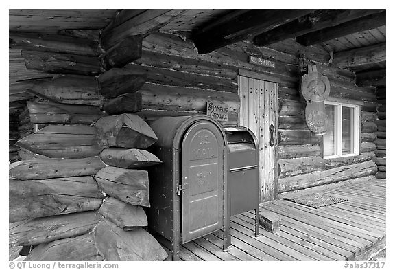 Mail boxes, log house postal office, Slana. Alaska, USA (black and white)