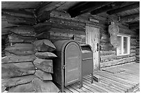 Mail boxes, log house postal office, Slana. Alaska, USA ( black and white)