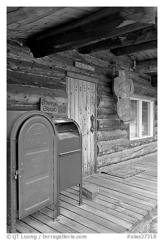 postal boxes, log house postal office, Slana. Alaska, USA (black and white)