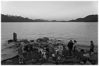 Families pickniking with fire, Resurrection Bay, sunset. Seward, Alaska, USA ( black and white)