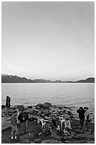 Family enjoying midnight picknik, Resurrection Bay, sunset. Seward, Alaska, USA ( black and white)