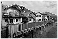 Waterfront houses on harbor. Seward, Alaska, USA (black and white)