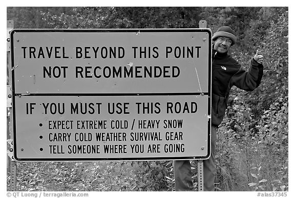 Sign with warnings about winter travel, Exit Glacier Road. Seward, Alaska, USA (black and white)