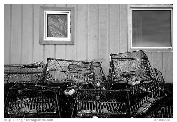 Fishing baskets and wall. Kotzebue, North Western Alaska, USA (black and white)