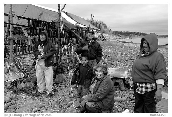 Inupiaq Eskimo family with stand of drying fish, Ambler. North Western Alaska, USA