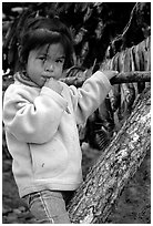 Inupiaq Eskimo girl near drying fish, Ambler. North Western Alaska, USA ( black and white)