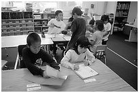 Inupiaq Eskimo kids in the classroom. Note names on table. Kiana. North Western Alaska, USA (black and white)