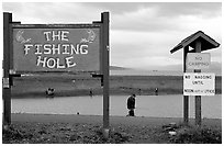 Fishing Hole signs. Homer, Alaska, USA ( black and white)