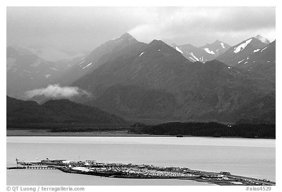 Distant view of the Spit and Kenai Mountains. Homer, Alaska, USA (black and white)