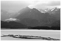 Distant view of the Spit and Kenai Mountains. Homer, Alaska, USA ( black and white)