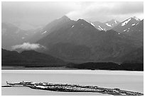 Distant view of the Spit and Kenai Mountains. Homer, Alaska, USA (black and white)