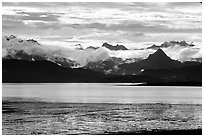 Low clouds haning over Kenai Mountains across Katchemak Bay. Homer, Alaska, USA (black and white)