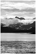 Low clouds hanging over Kenai Mountains across Katchemak Bay. Homer, Alaska, USA ( black and white)
