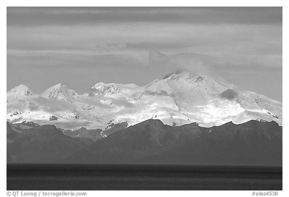 Mt Iliamna, a volcano in Lake Clark National Park, seen across the Cook Inlet. Ninilchik, Alaska, USA (black and white)