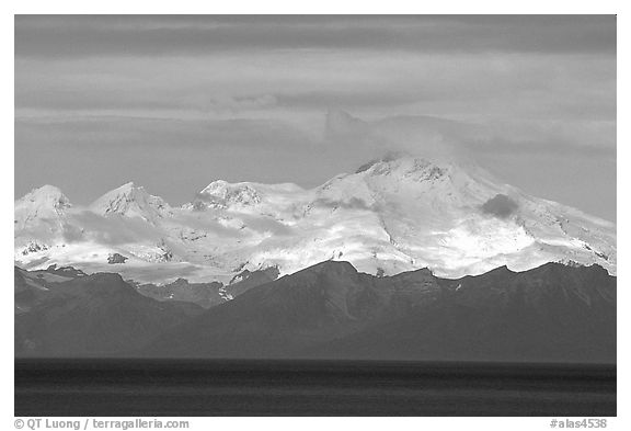 Mt Iliamna, a volcano in Lake Clark National Park, seen across the Cook Inlet. Ninilchik, Alaska, USA