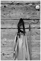 Waders hanging on a cabin wall. Ninilchik, Alaska, USA ( black and white)