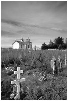 Russian orthodox cemetery and old Russian church. Ninilchik, Alaska, USA ( black and white)