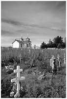 Russian orthodox cemetery and old Russian church. Ninilchik, Alaska, USA (black and white)