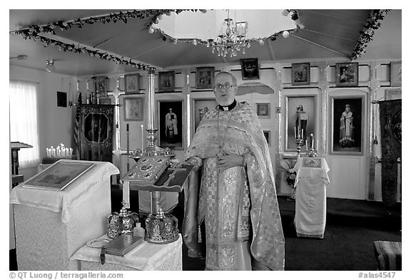 Orthodox priest inside the old Russian church. Ninilchik, Alaska, USA (black and white)