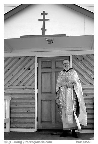 Orthodox priest ouside the old Russian church. Ninilchik, Alaska, USA (black and white)