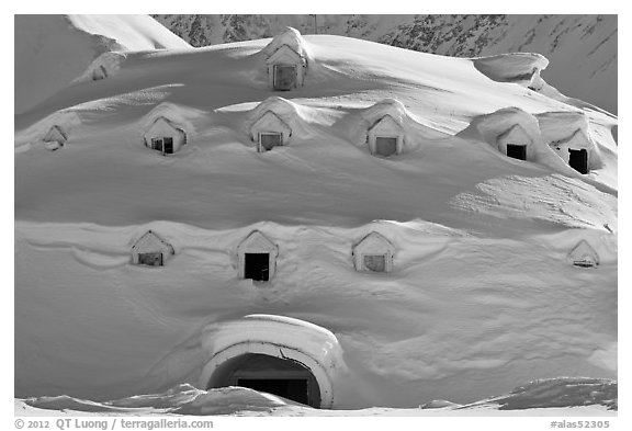 Snow-covered igloo-shaped building. Alaska, USA (black and white)