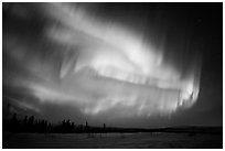 Magnetic storm in sky above snowy meadow. Alaska, USA ( black and white)