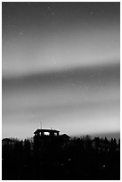 Hilltop house and Aurora Borealis. Alaska, USA ( black and white)