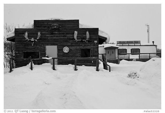Log cabin and Slate Creek Motel, Coldfoot. Alaska, USA (black and white)