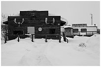 Log cabin and Slate Creek Motel, Coldfoot. Alaska, USA ( black and white)