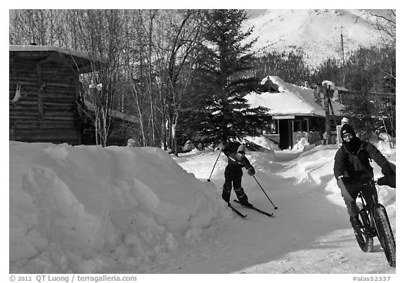 Winter recreation with snow-tired bike and skis. Wiseman, Alaska, USA (black and white)