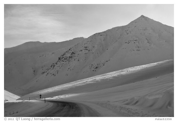 James W Dalton Highway at its highest point at Atigun Pass. Alaska, USA (black and white)