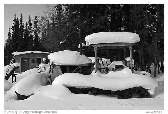 Machinery covered in snow. Wiseman, Alaska, USA