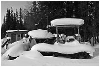 Machinery covered in snow. Wiseman, Alaska, USA ( black and white)