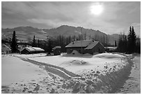 Backlit view of snow-covered village. Wiseman, Alaska, USA ( black and white)