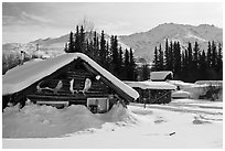Heavily snow-covered cabins in winter. Wiseman, Alaska, USA ( black and white)