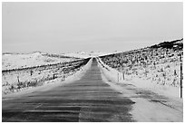 Windblown drifted snow across Dalton Highway. Alaska, USA ( black and white)
